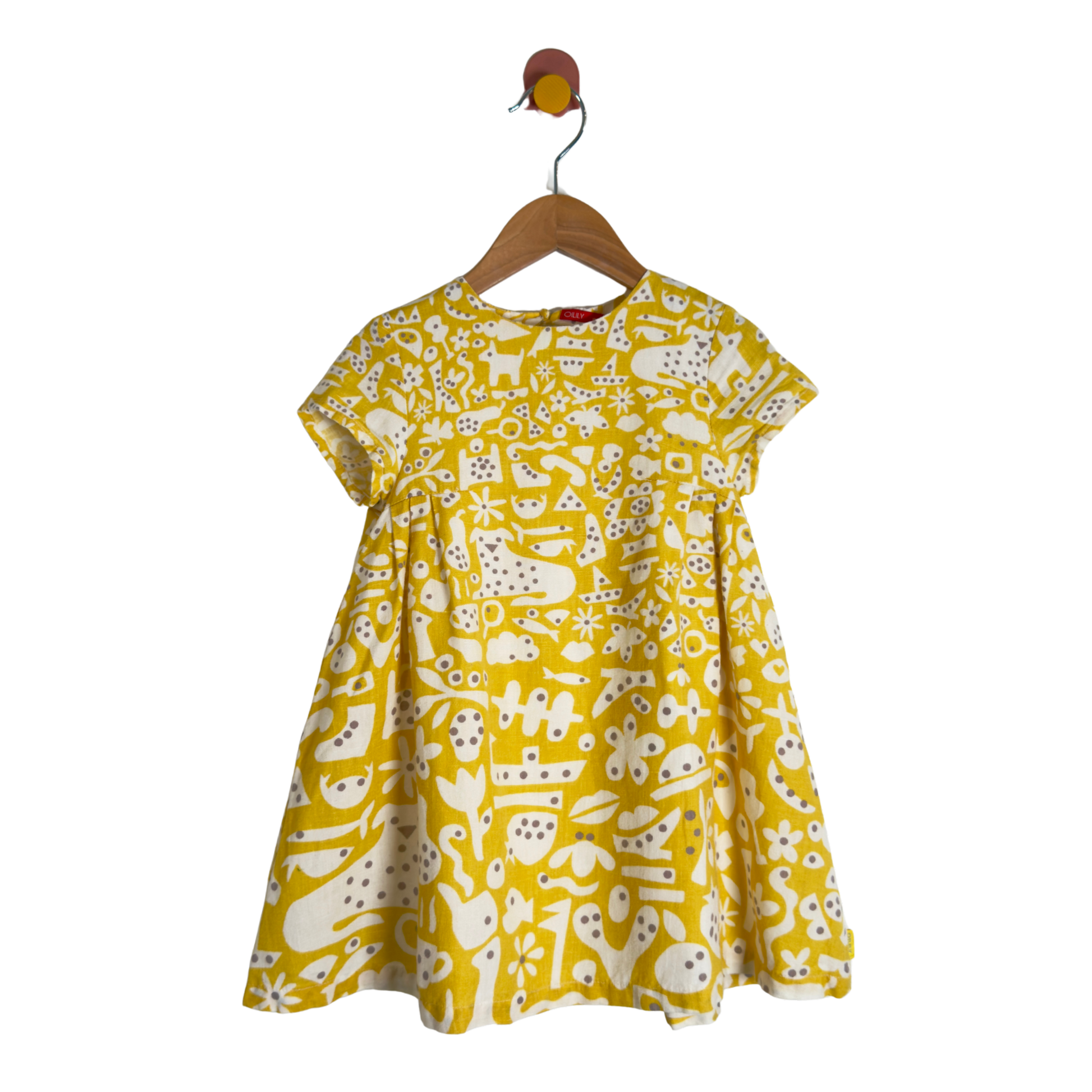 A yellow short-sleeve dress with a white abstract pattern, hanging on a wooden hanger against a plain white background.