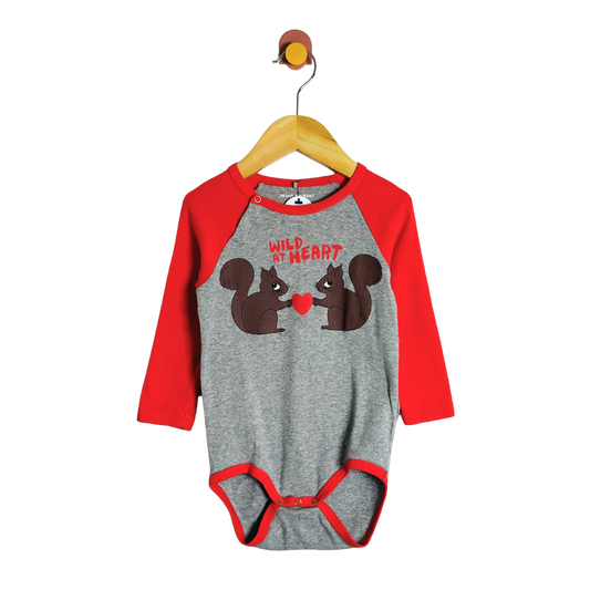 Gray and red baby onesie with squirrel design on a hanger against a white background