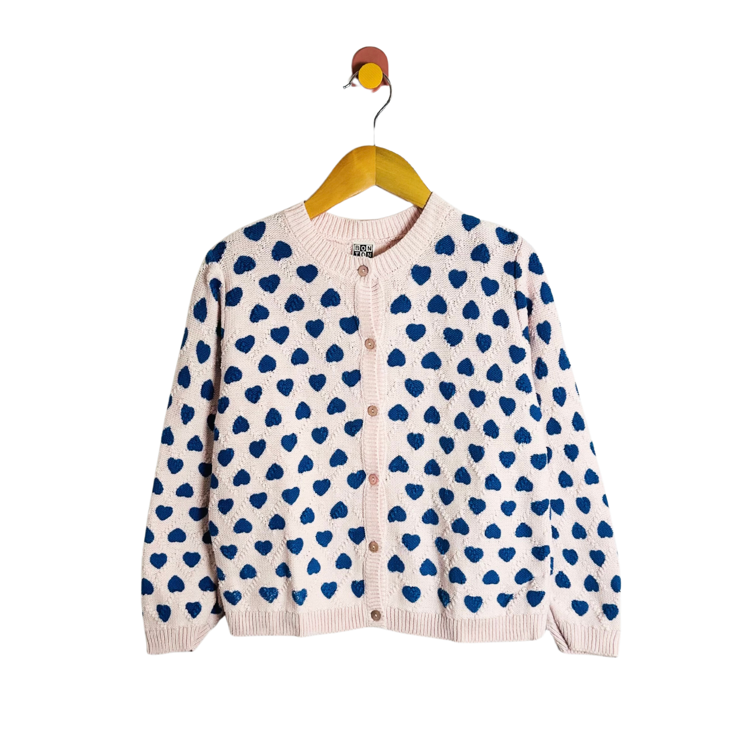 Cardigan with blue heart pattern on a white background