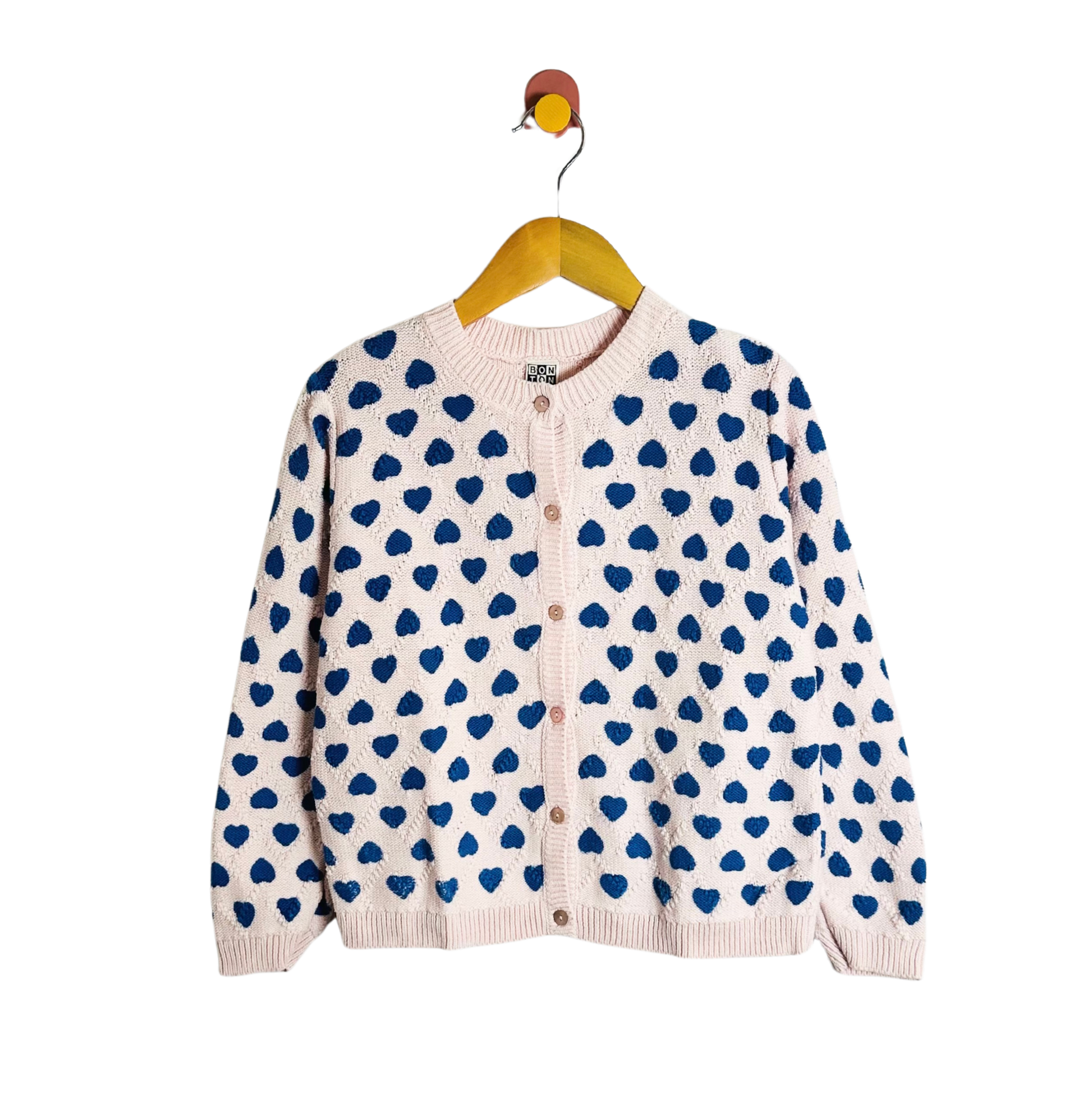 Cardigan with blue heart pattern on a white background