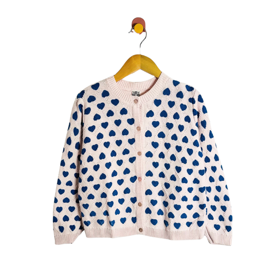 Cardigan with blue heart pattern on a white background