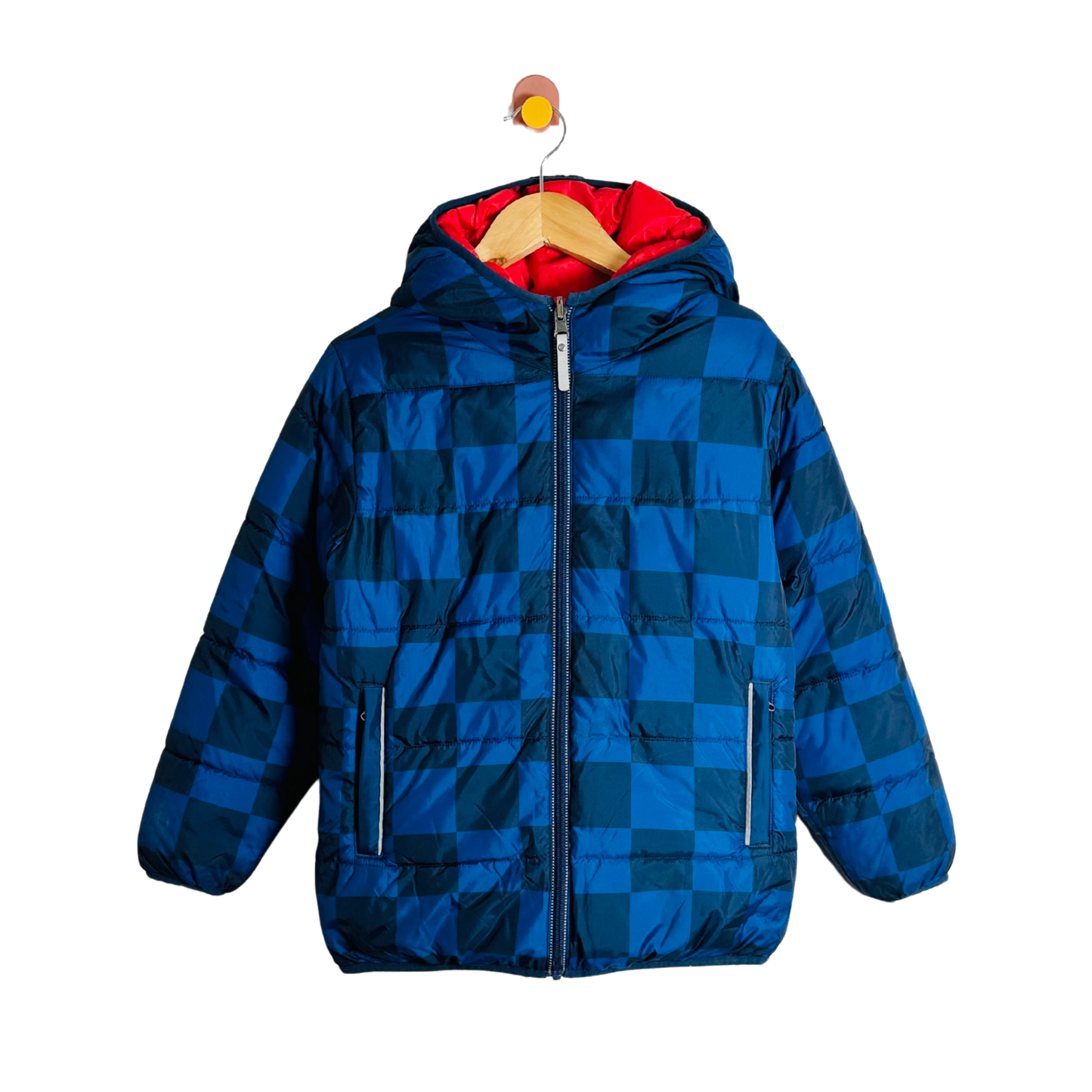 Blue checkered coat with red lining on a hanger against a white background