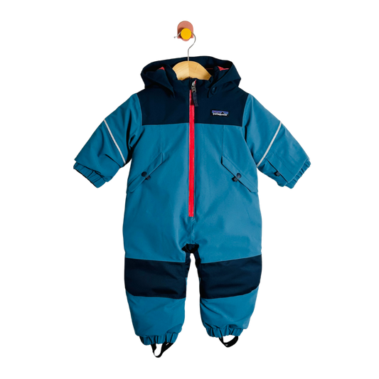 Blue children's snowsuit with red zipper on a white background
