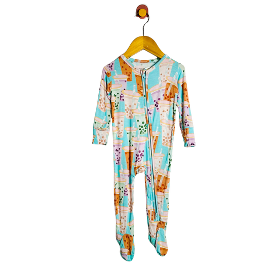 Colorful onesie with a pattern on a hanger against a white background