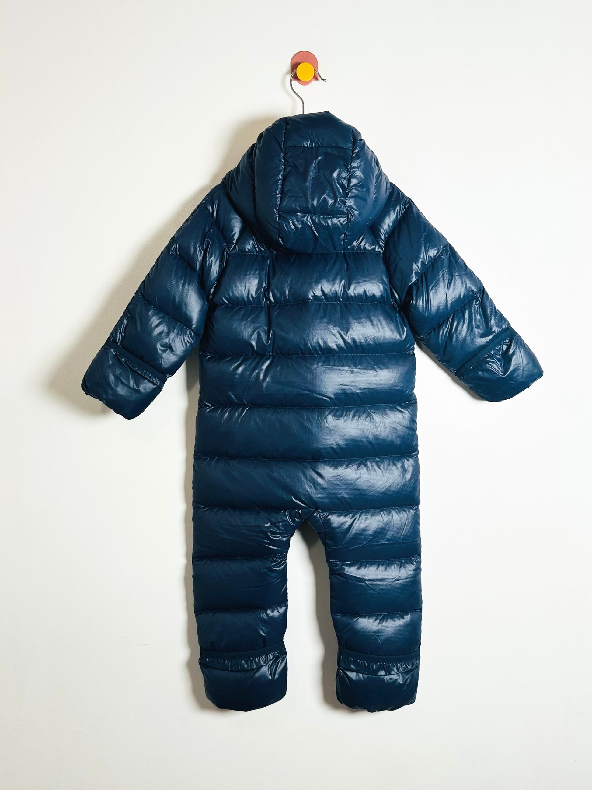 Blue puffer snowsuit on a white background