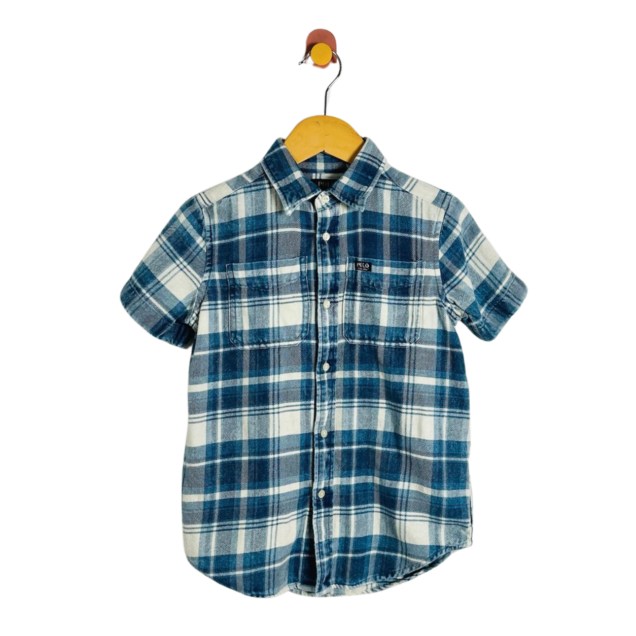 A short-sleeve plaid button-up shirt in blue and white, hanging on a wooden hanger against a plain white background.