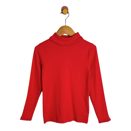 A bright red long-sleeve mock neck sweater hanging on a wooden hanger against a plain white background.