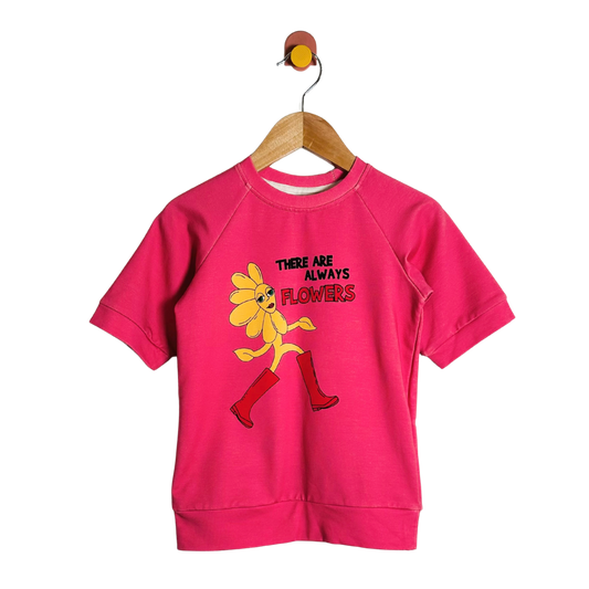 Pink sweatshirt with cartoon character and text on a white background