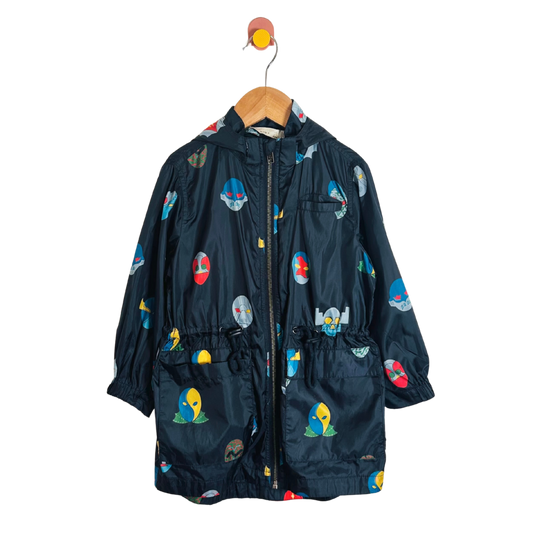 Children's dark blue raincoat with colorful cartoon designs on a white background