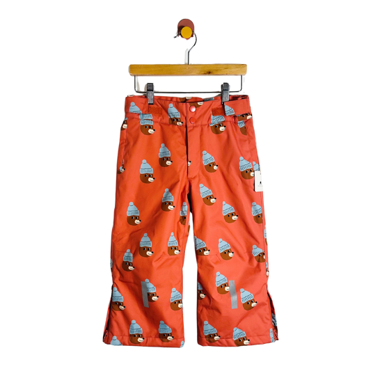 Red pants with bear pattern on a hanger against a white background