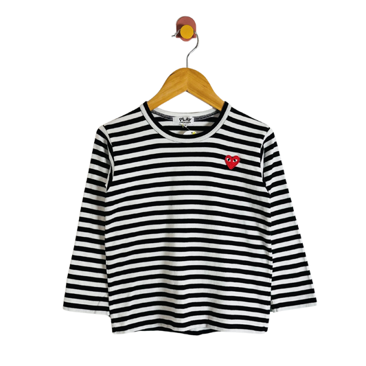 Black and white striped long-sleeve shirt with a red heart on a hanger against a white background