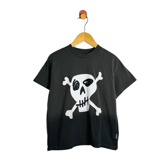 A black short-sleeve t-shirt with a white skull and crossbones graphic on the front, hanging on a wooden hanger against a plain white background.