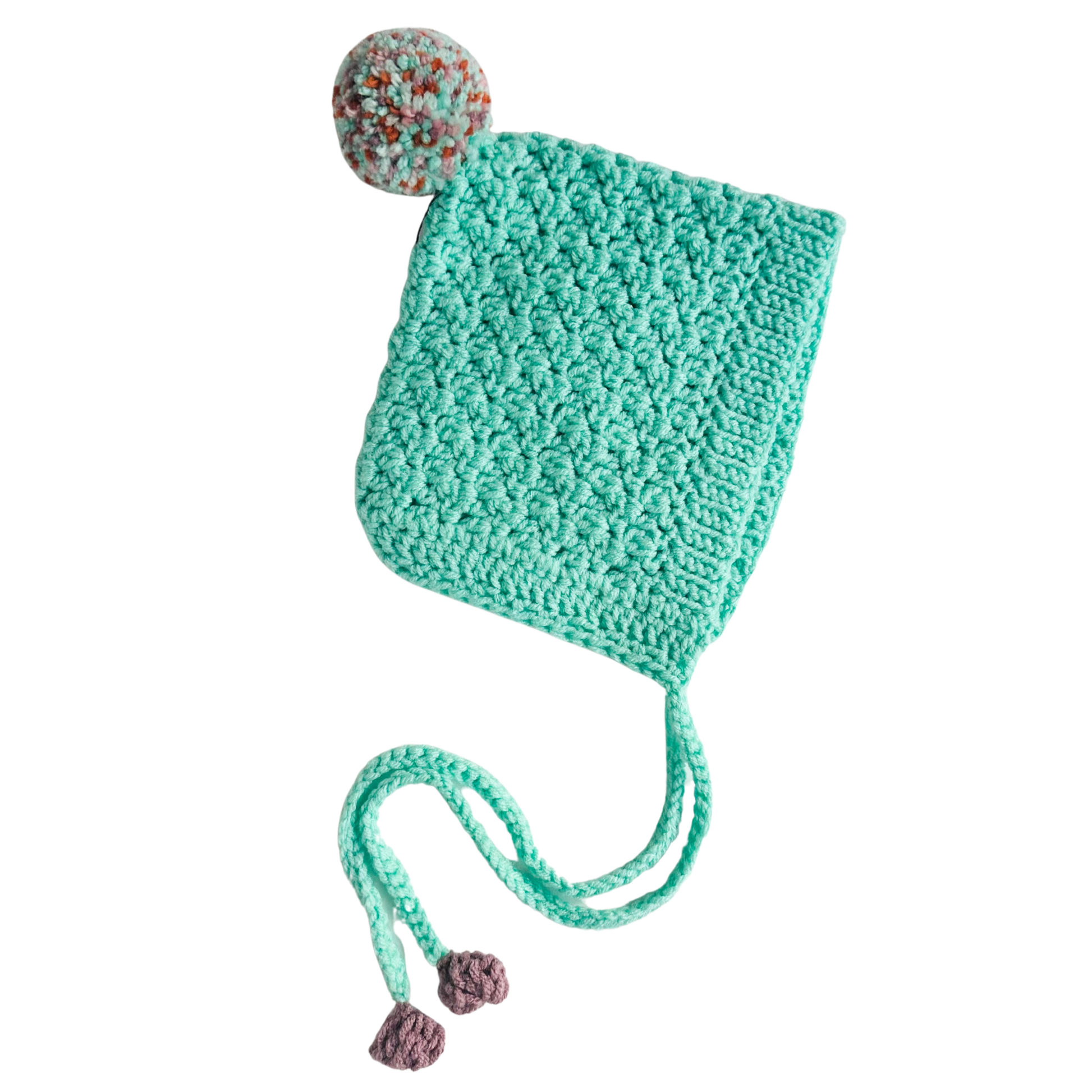 Teal knitted hat with pom-poms on a white background