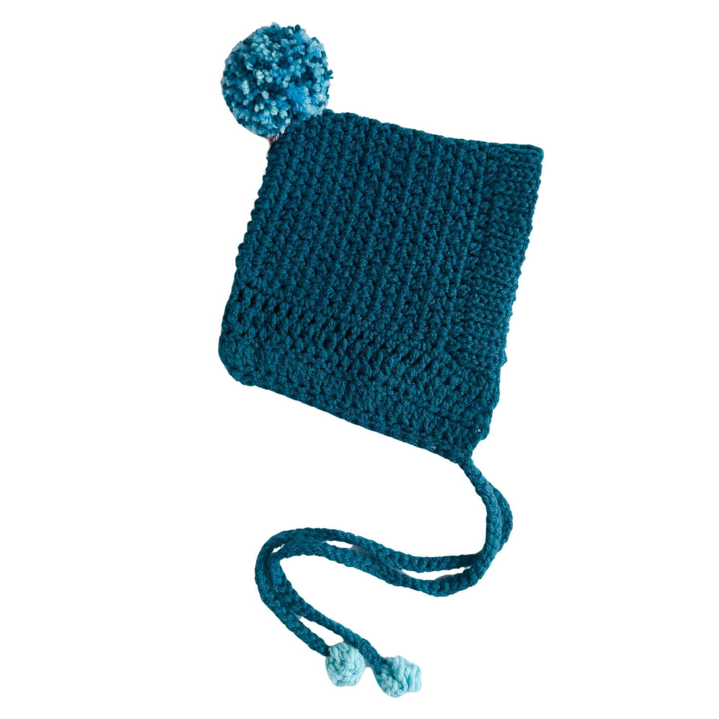 Blue knitted hat with a pom-pom on a white background