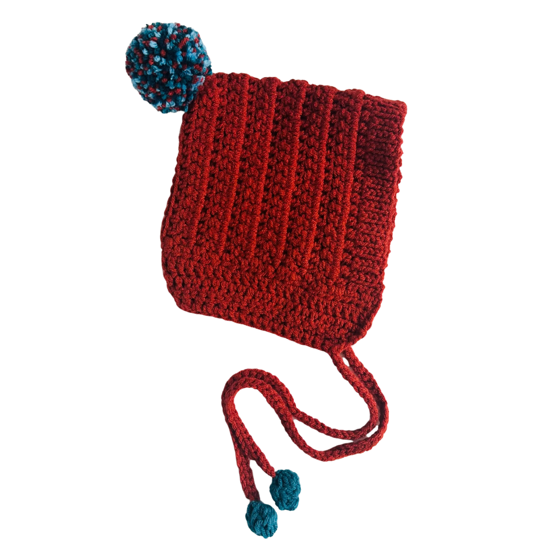 Red knitted hat with blue pom-poms on a white background