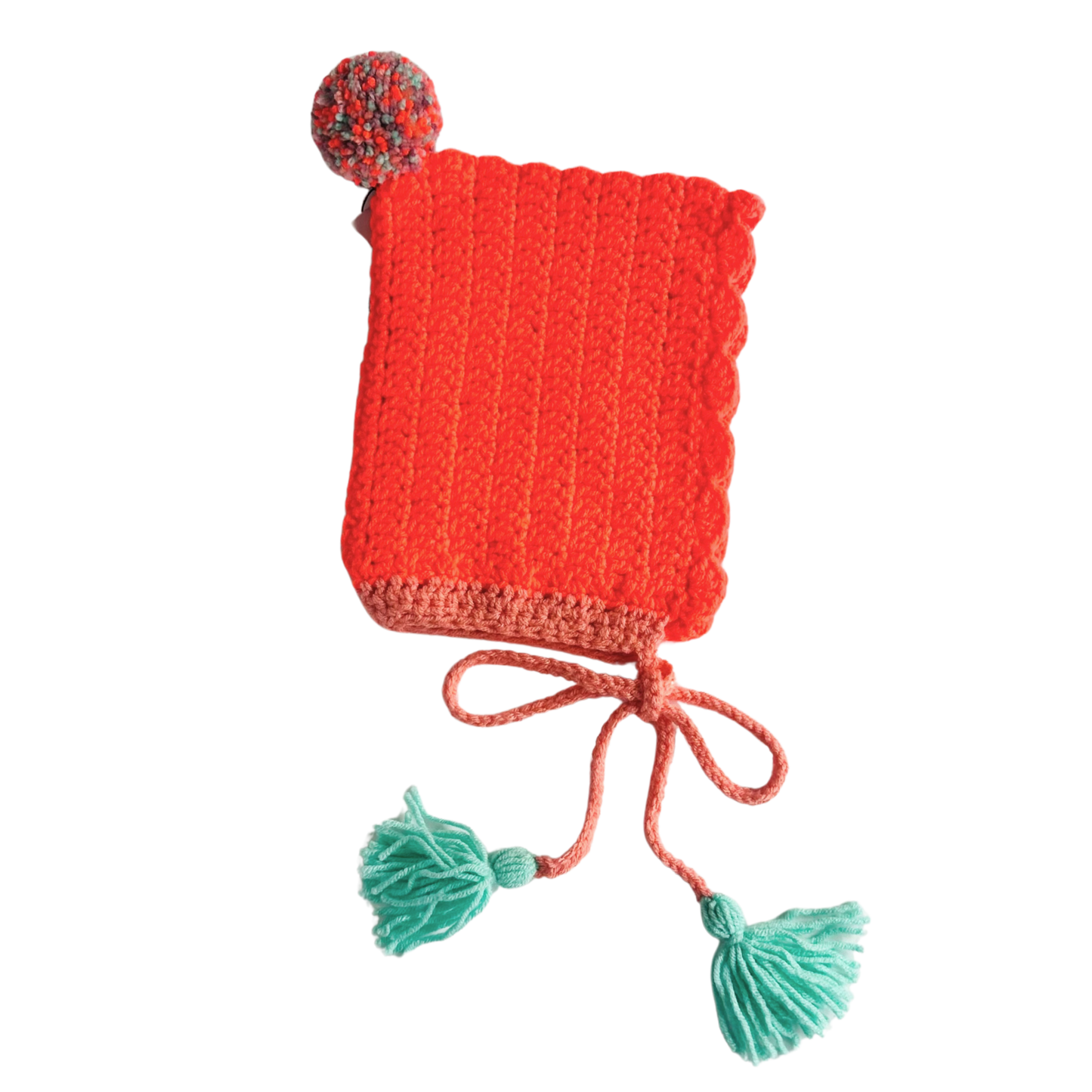 orange knitted hat with pom-poms on a white background