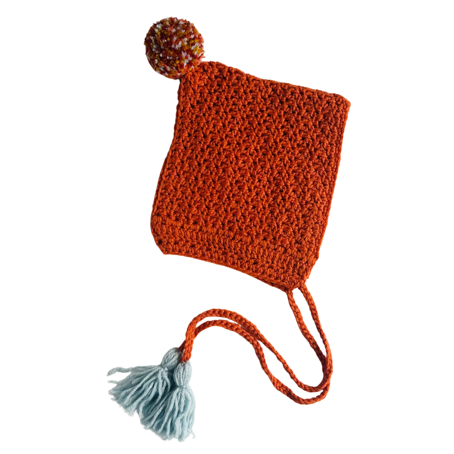 Knitted hat with a pom-pom on a white background