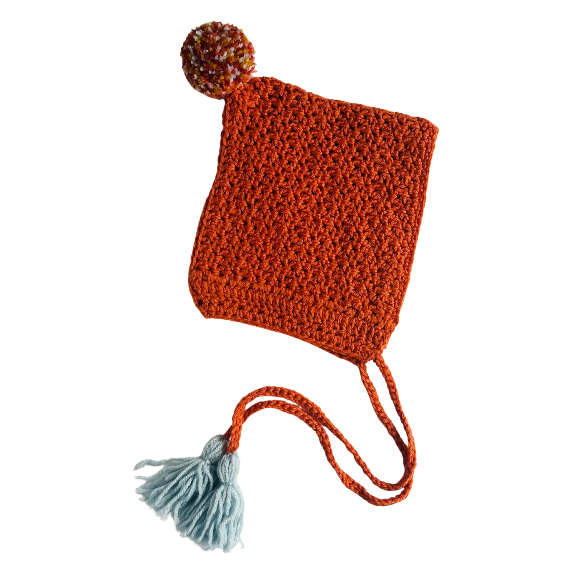 Knitted hat with a pom-pom on a white background