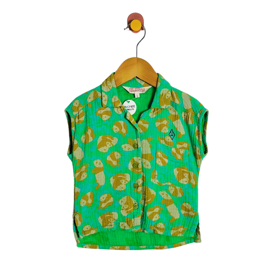 A green sleeveless button-front vest with an allover tan and cream panda print, hanging on a wooden hanger against a plain white background.