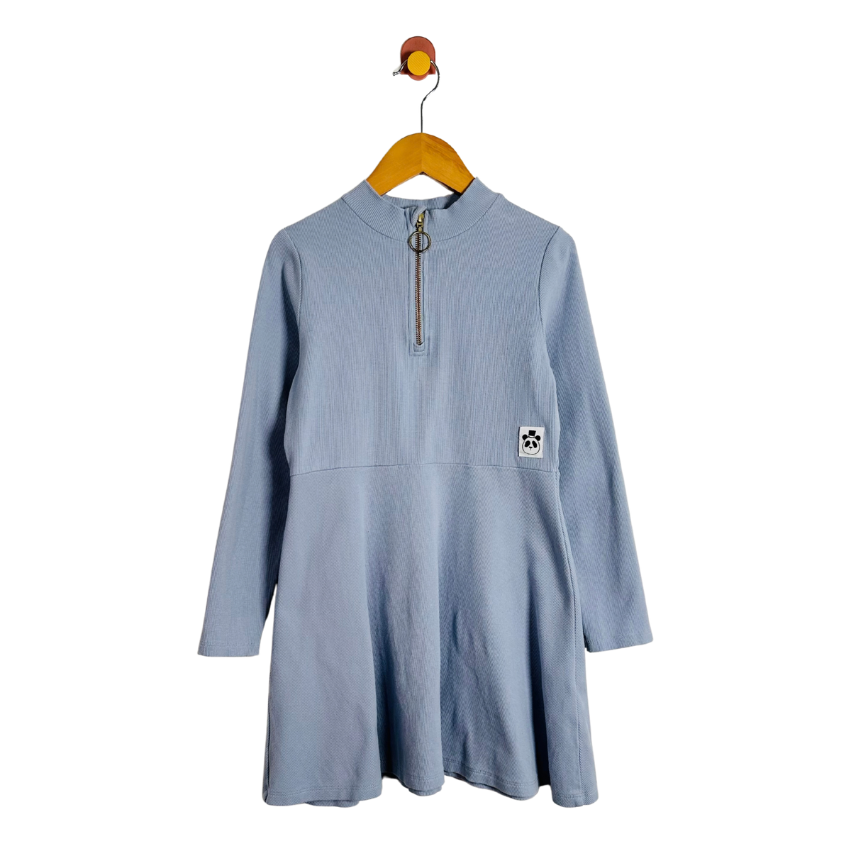 A light blue long-sleeve dress with a mock neck and a half-zip front, hanging on a wooden hanger against a plain white background.