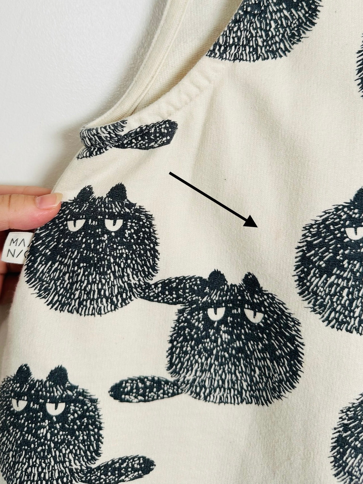 detail of cat romper
