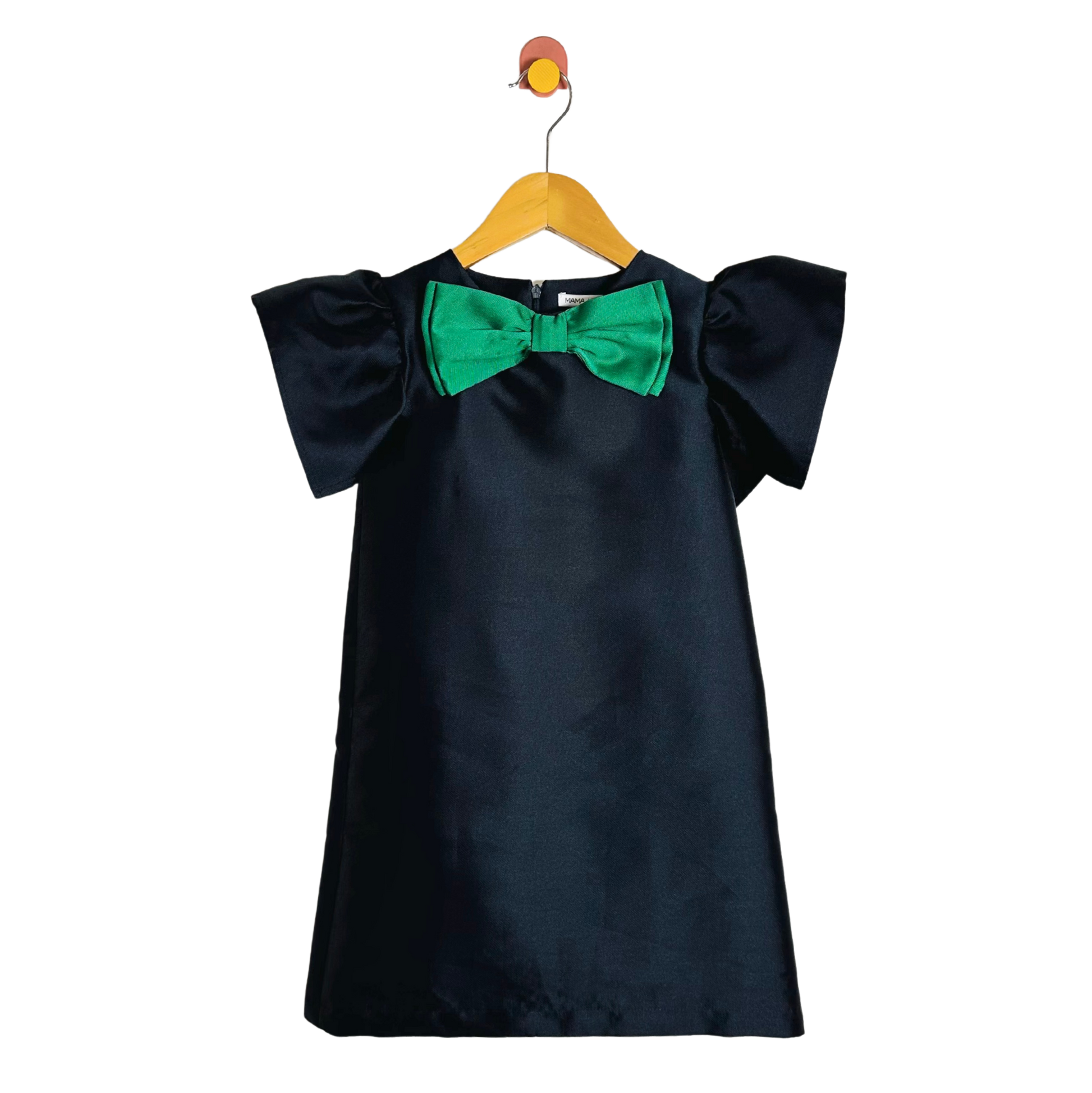 Blue dress with green bow on a hanger against a white background