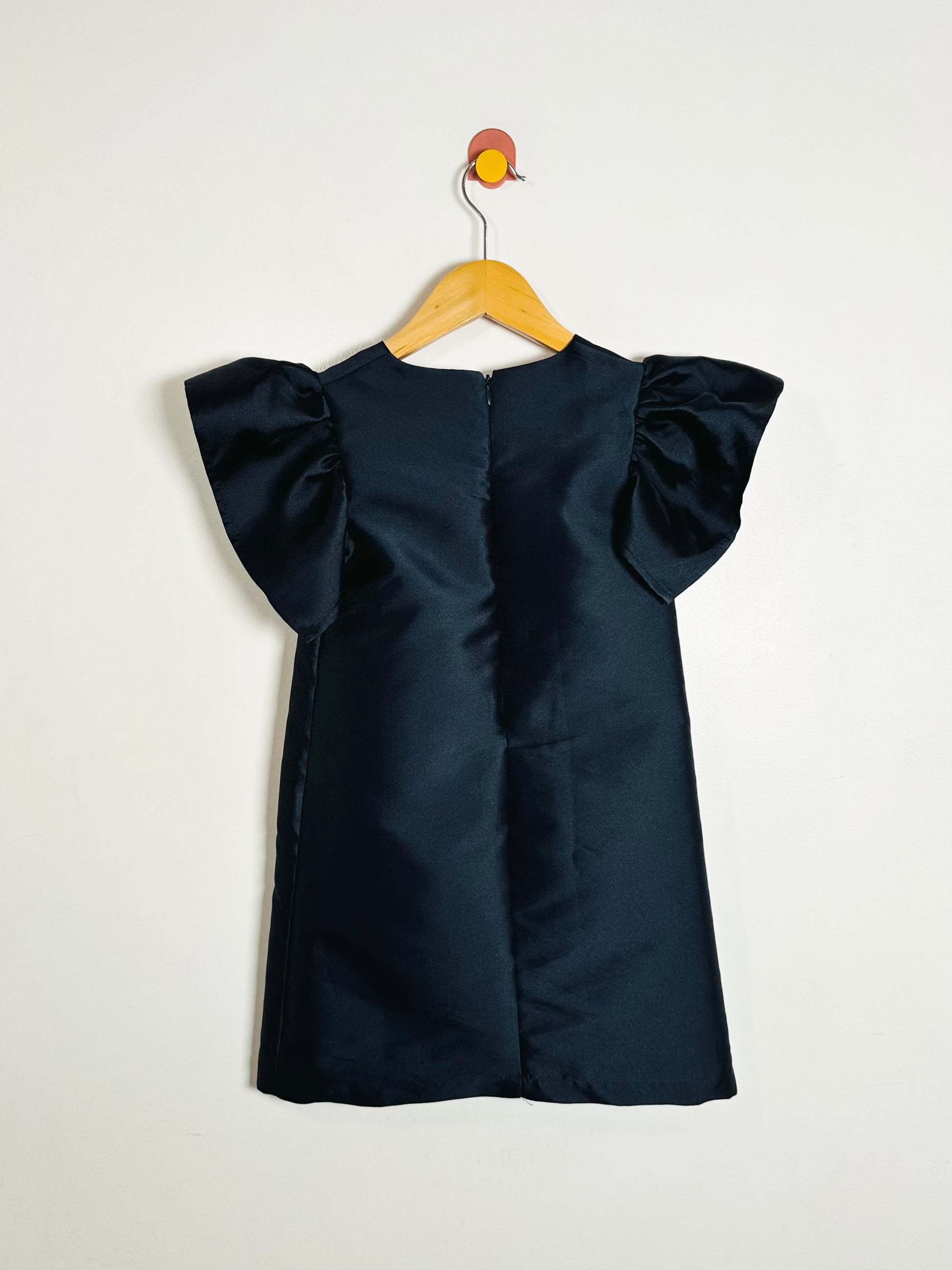Navy blue dress with ruffled sleeves on a white background