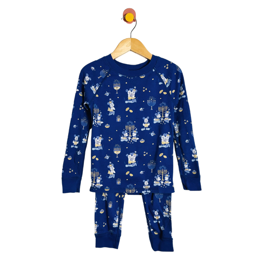 Children's blue pajama set with festive design on a white background