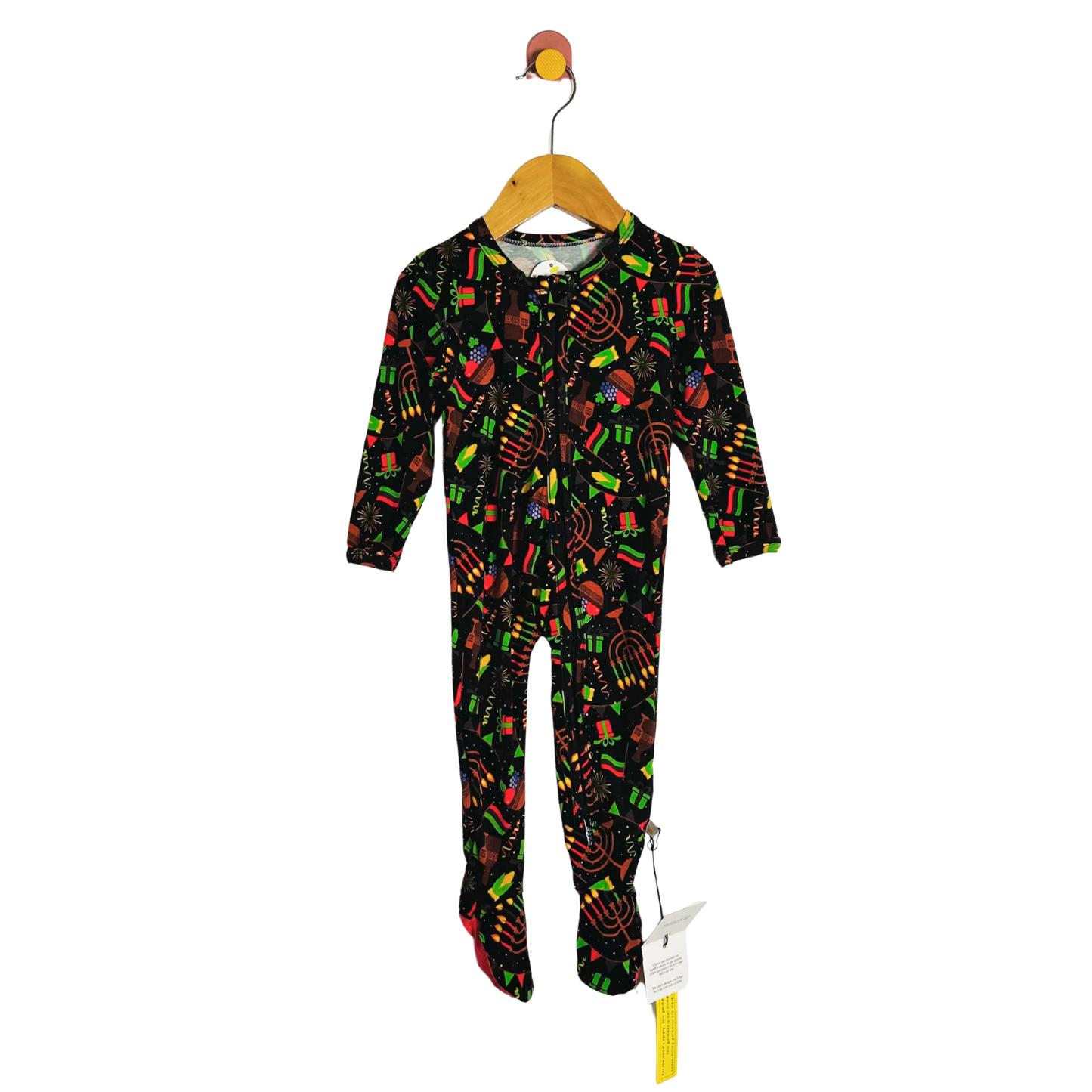 Children's onesie with colorful patterns on a hanger against a white background
