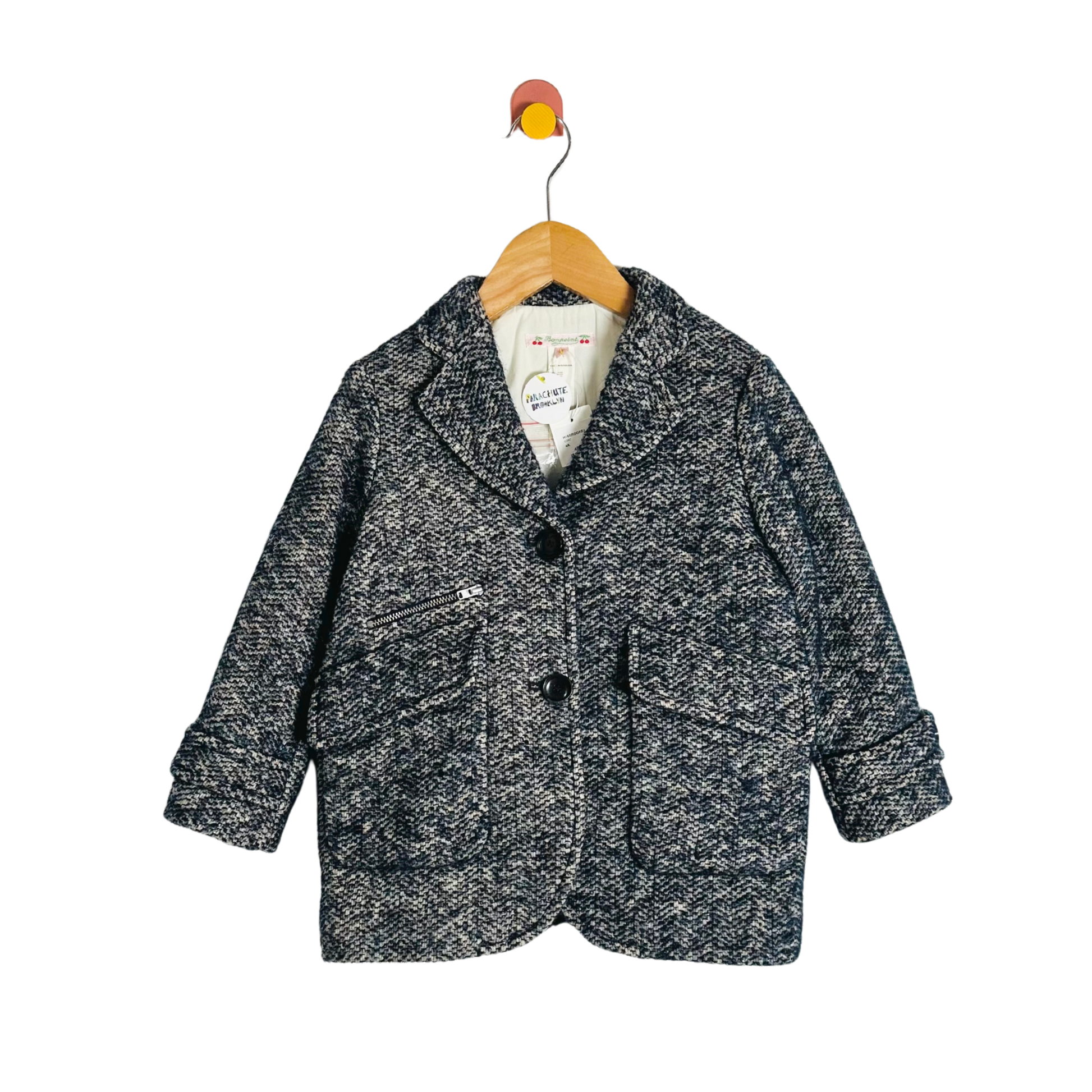 Children's gray textured coat on a hanger with a white background