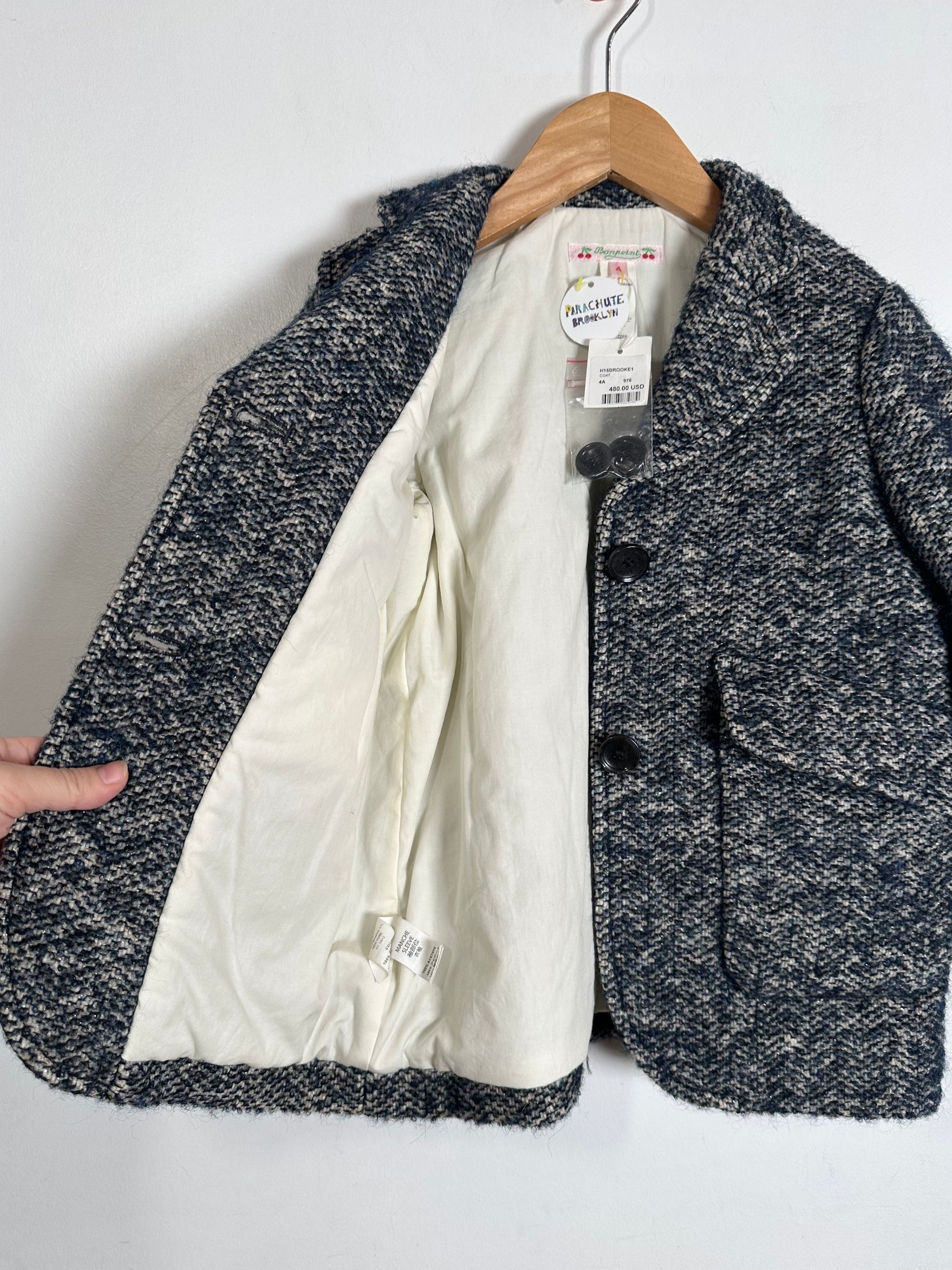 jacket  with a visible brand tag on a white background