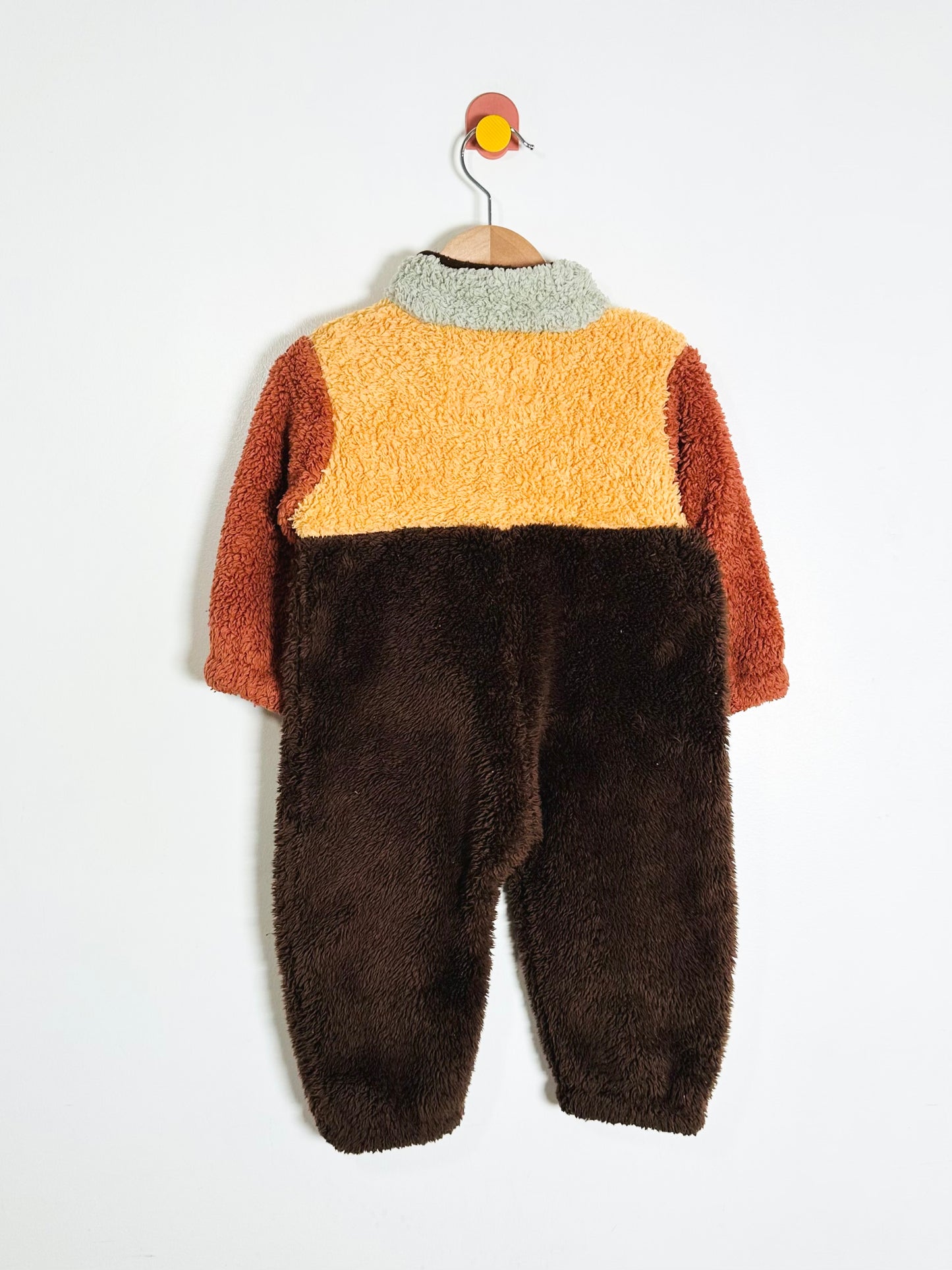 Children's fuzzy outfit with a color-blocked design on a white background