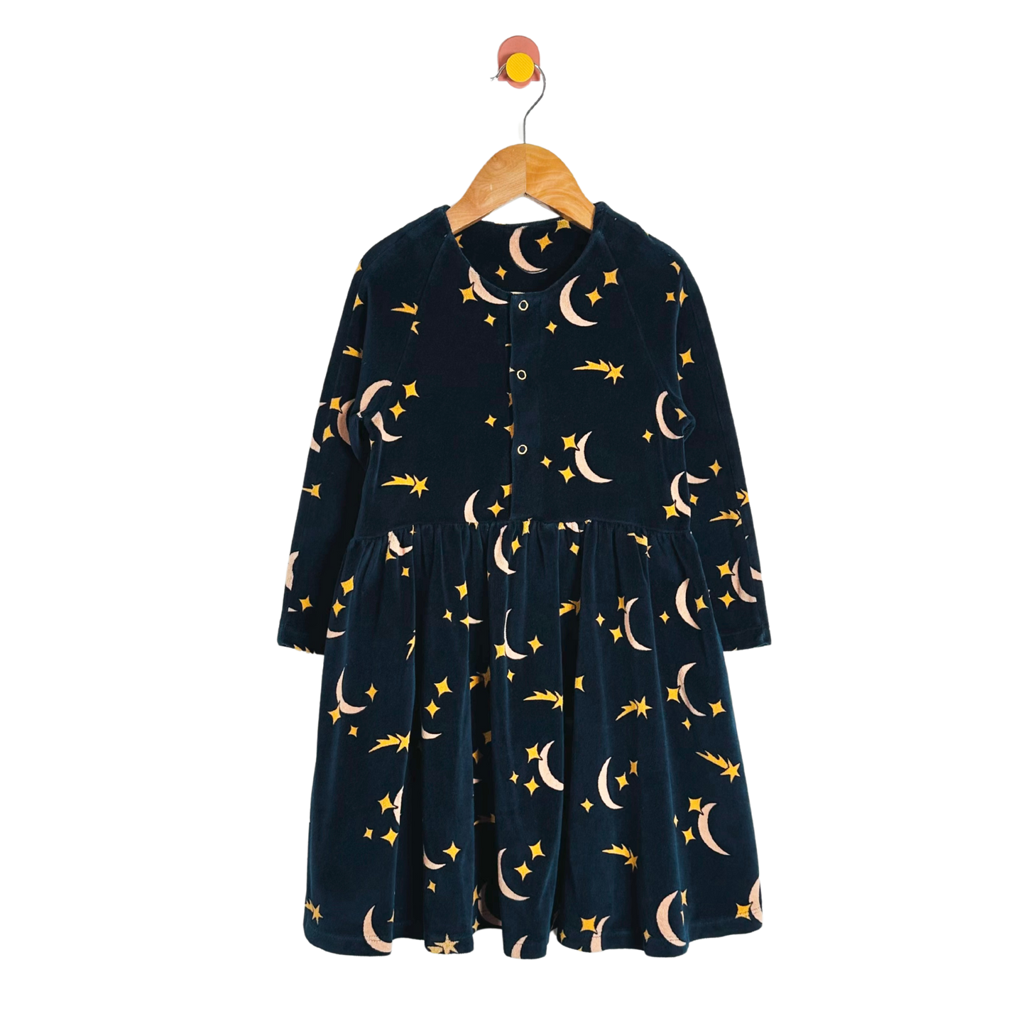 Navy blue dress with celestial pattern on a hanger against a white background