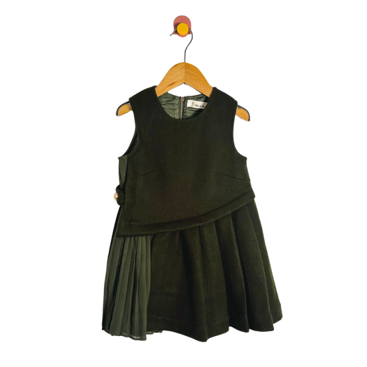 Green dress on a hanger against a white background