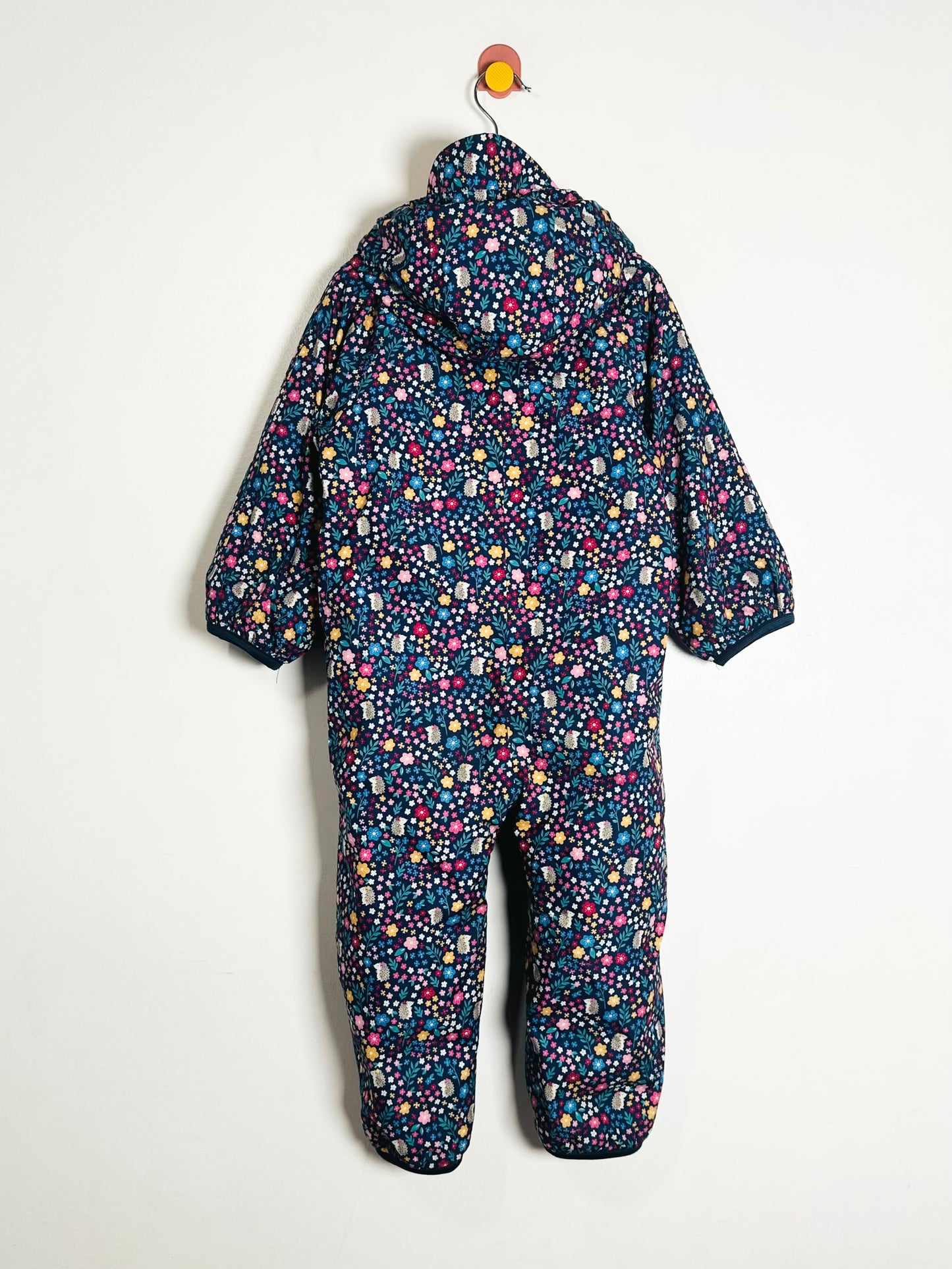 Children's floral-patterned snowsuit on a white background