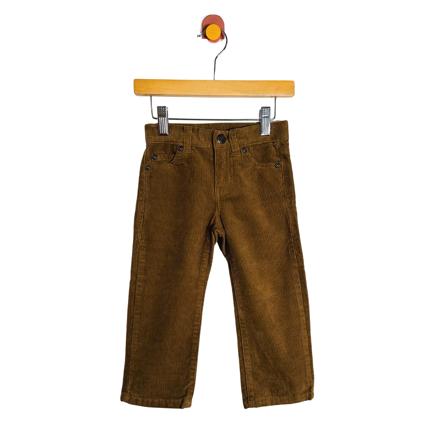 Brown corduroy pants on a wooden hanger against a white background