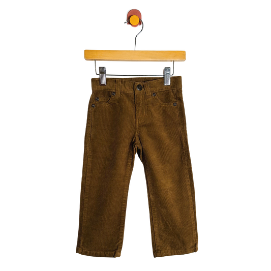 Brown corduroy pants on a wooden hanger against a white background