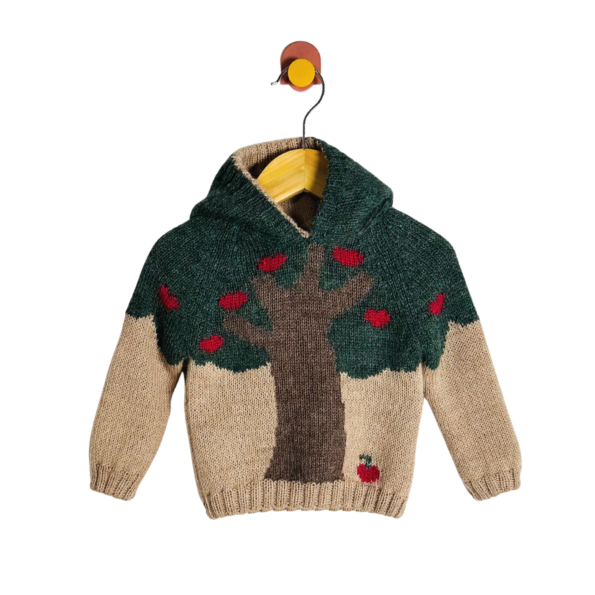 Children's sweater with tree and apple design on a white background