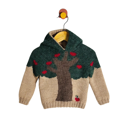Children's sweater with tree and apple design on a white background