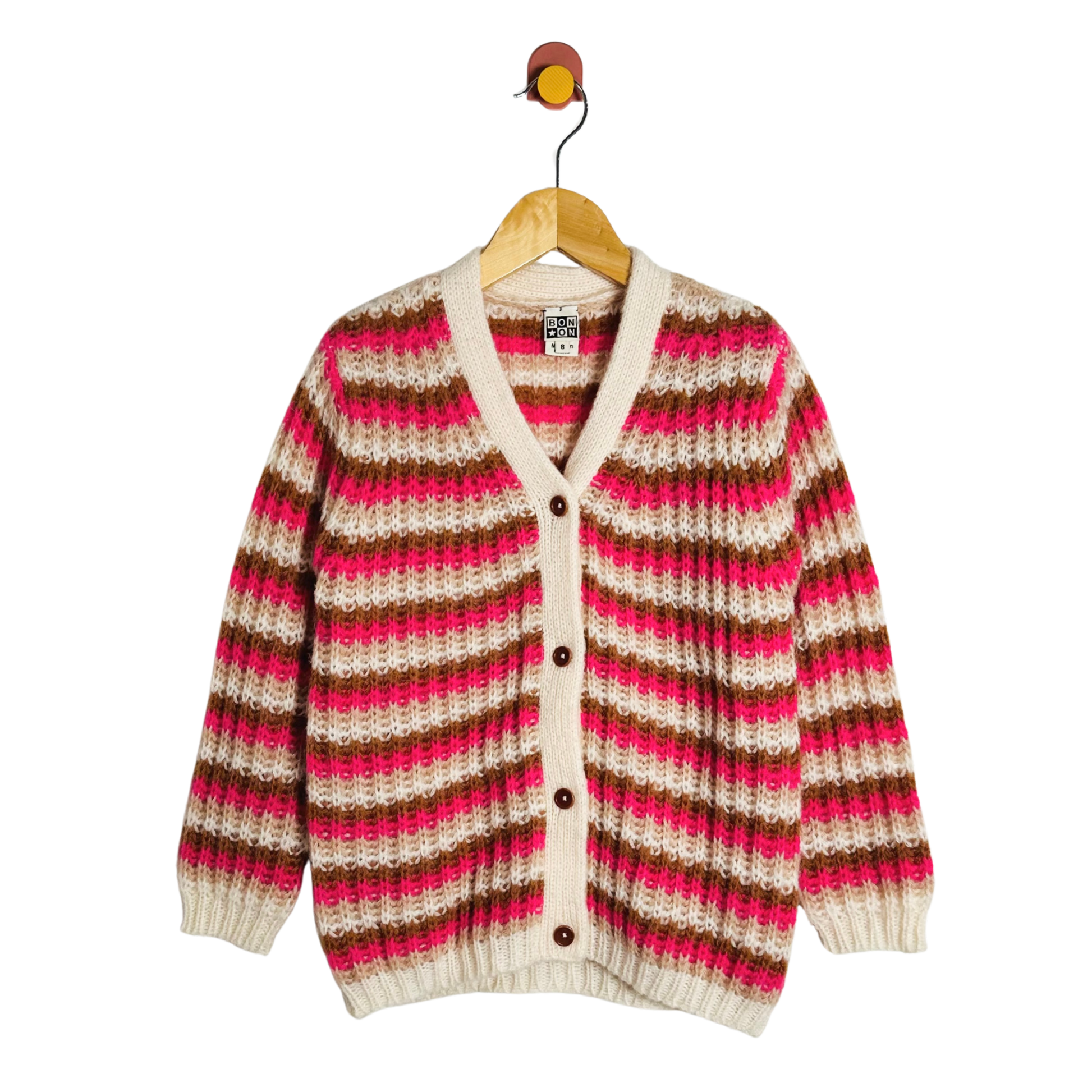 Striped cardigan on a hanger against a white background