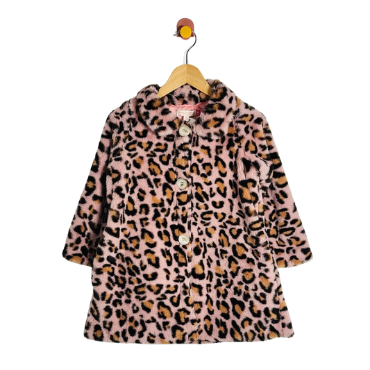 A pink faux fur coat with a leopard print pattern, hanging on a wooden hanger against a white background.