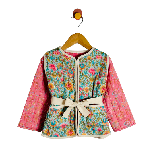 Floral-patterned jacket with pink sleeves on a hanger against a white background
