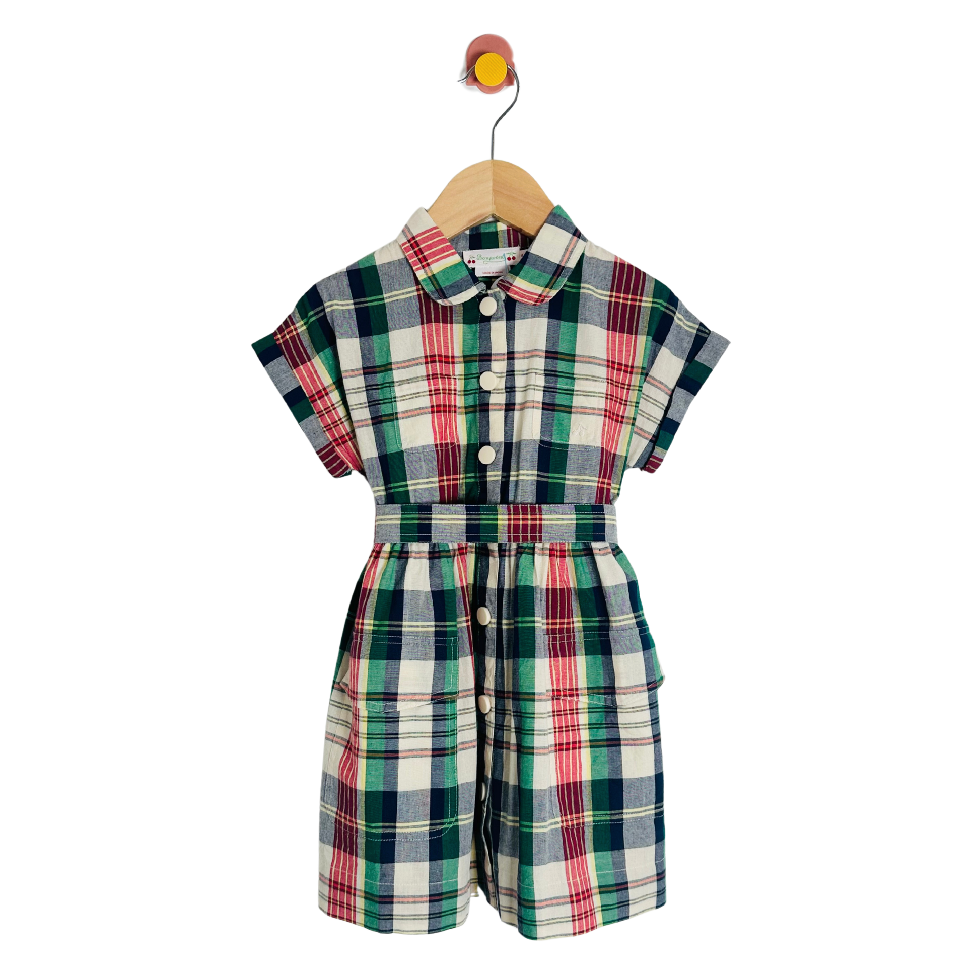 Plaid romper on a wooden hanger against a white background
