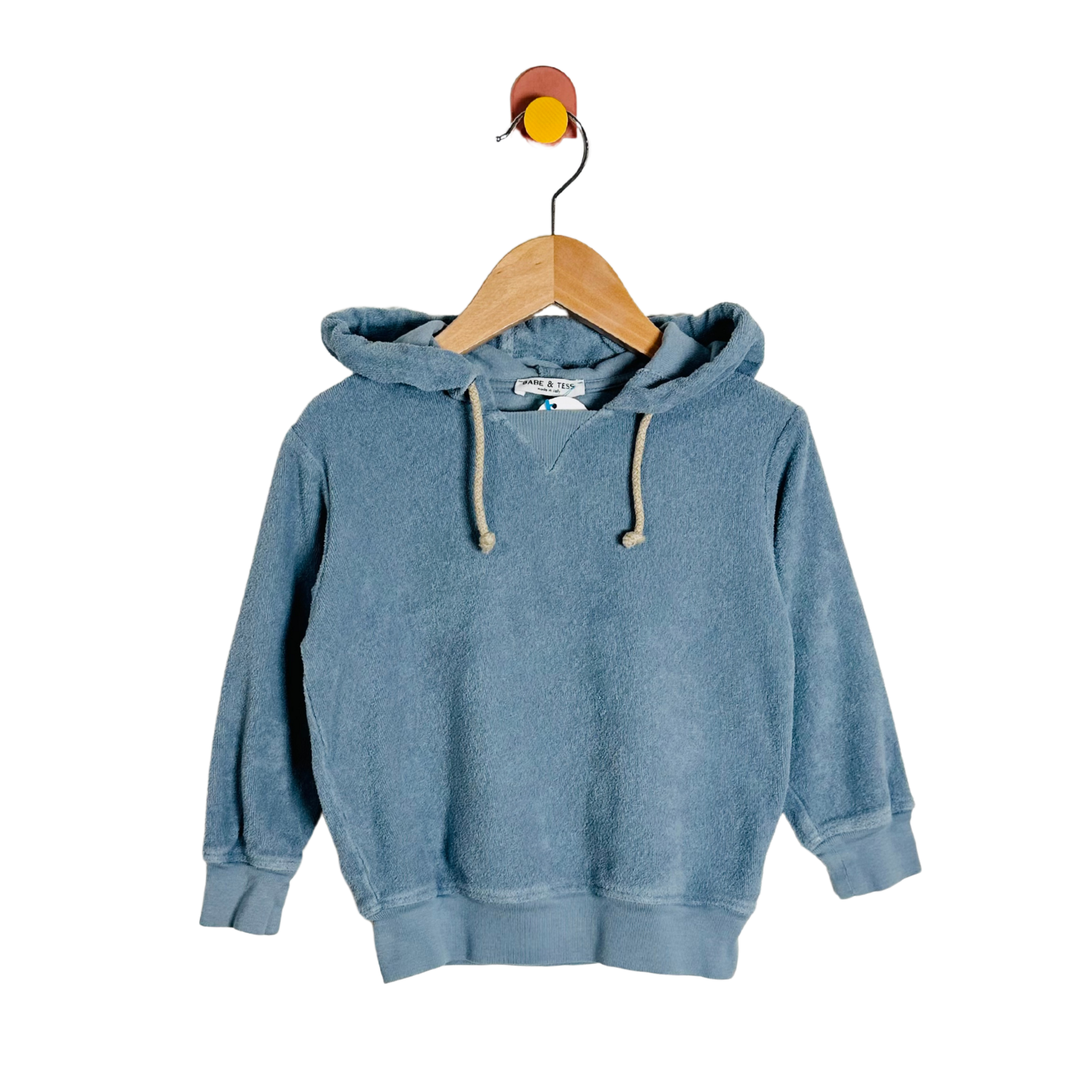 Blue hoodie on a wooden hanger against a white background