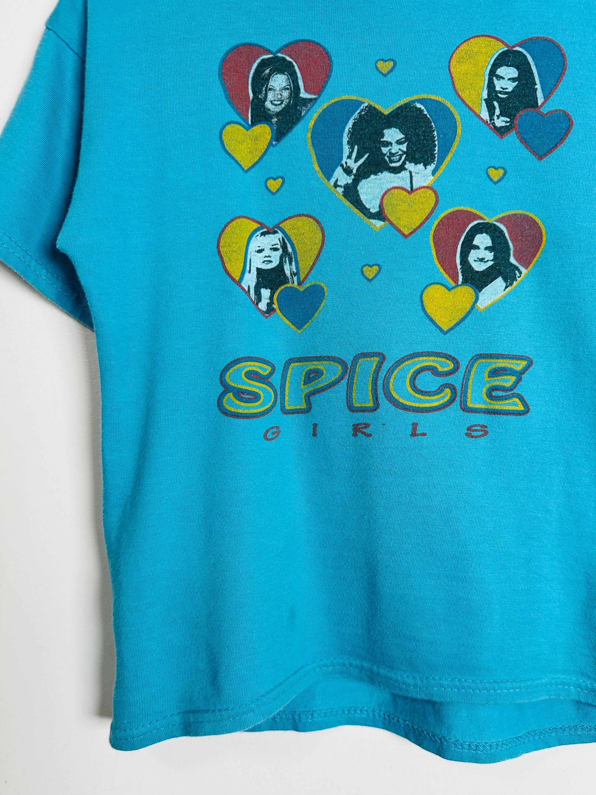 Blue t-shirt with 'Spice Girls' graphic design on a white background