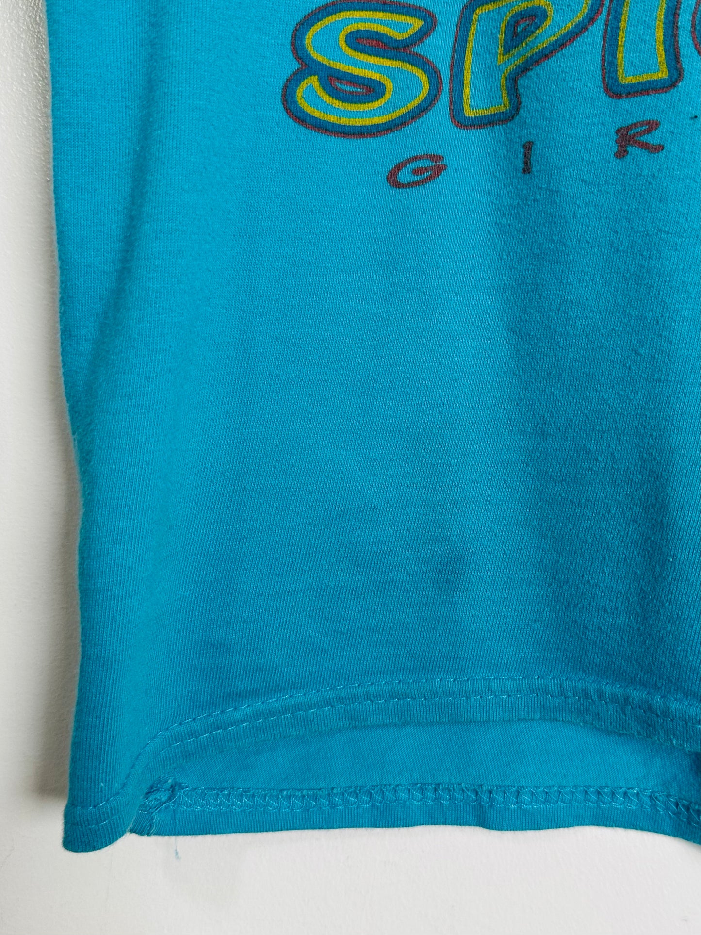 Blue t-shirt with text on a white background