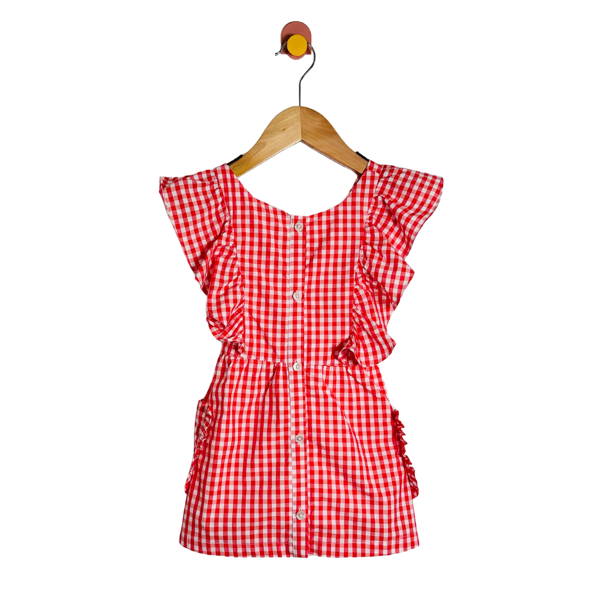 Red and white checkered dress on a wooden hanger against a white background