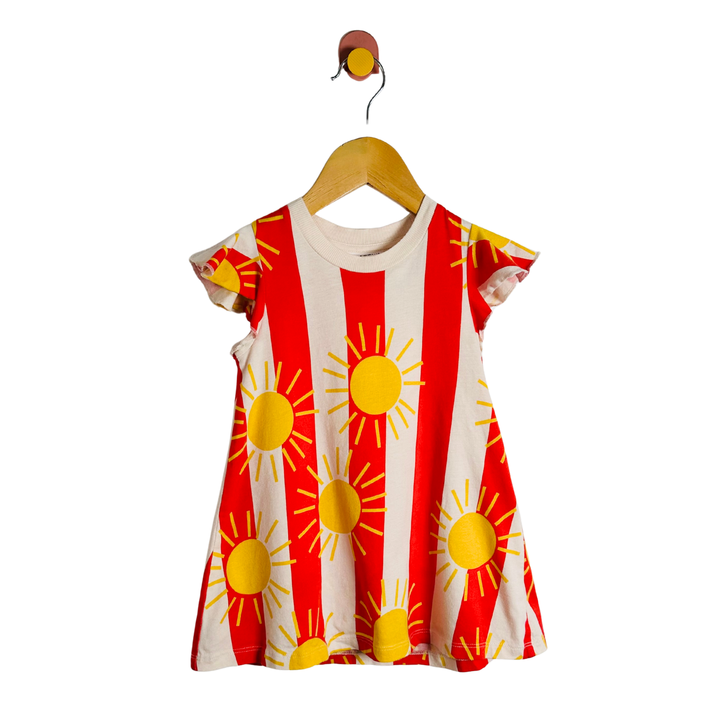 Red and white dress with yellow sun patterns on a hanger against a white background