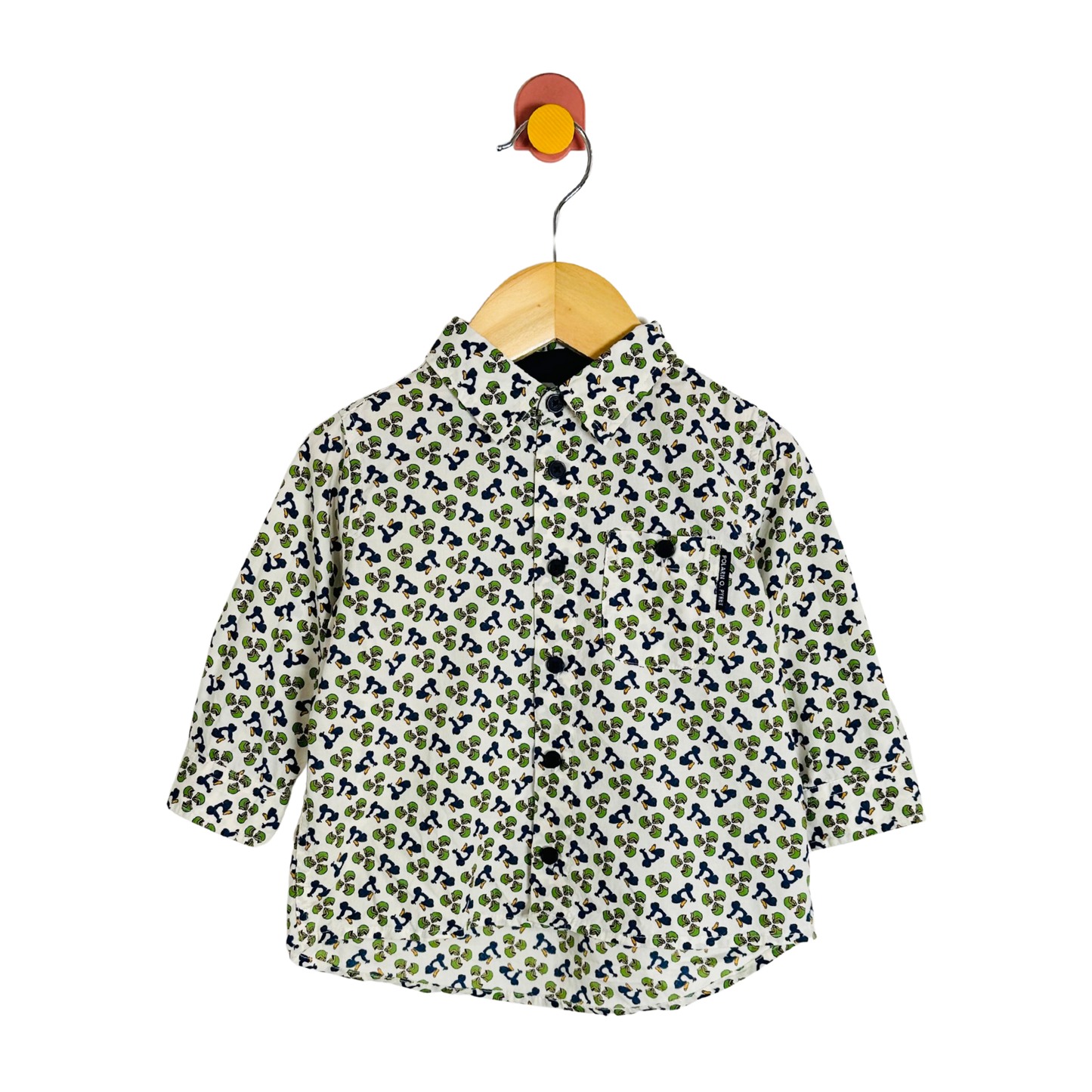 Floral patterned shirt on a wooden hanger against a white background