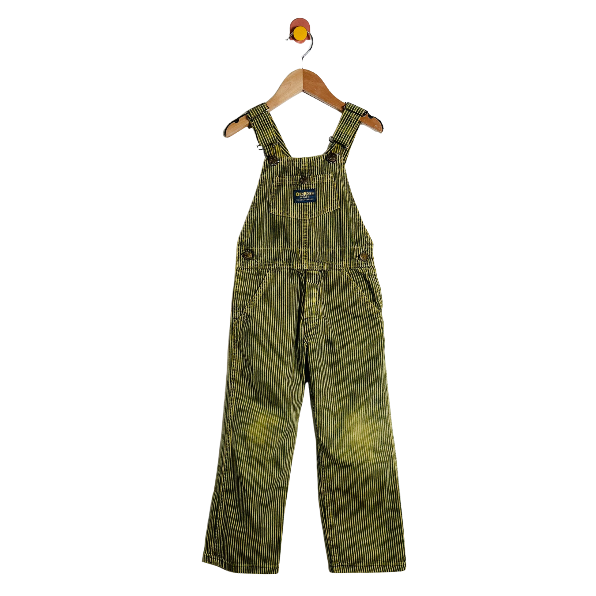 Striped overalls on a hanger against a white background